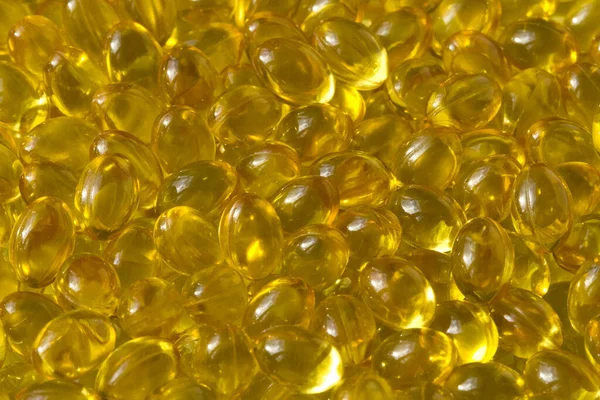 Gouden Achtergrond Capsules Close Voedingssupplement Olie Gevulde Capsules Geschikt Vitamine — Stockfoto