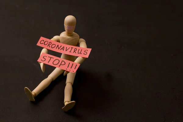 Figure Wooden Man Sits Asks Coronavirus Stop Pandemic Panic Recovery — Stock Photo, Image