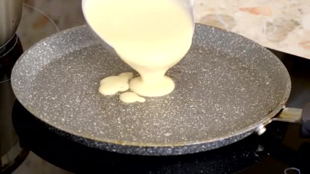 Ladle Pours Dough Russian Pancakes Hot Pan Female Hand Distributes — Stock Video