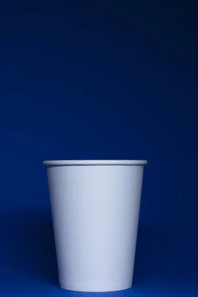 Empty White Paper Cup Blue Background Vertical Photo — Stock Photo, Image