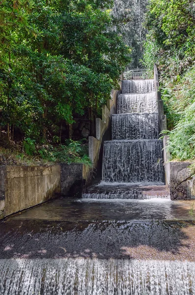 Man made waterfall running down the cascade structure