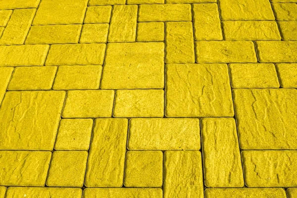 Square blocks paving background toned in yelllow — Stock Photo, Image