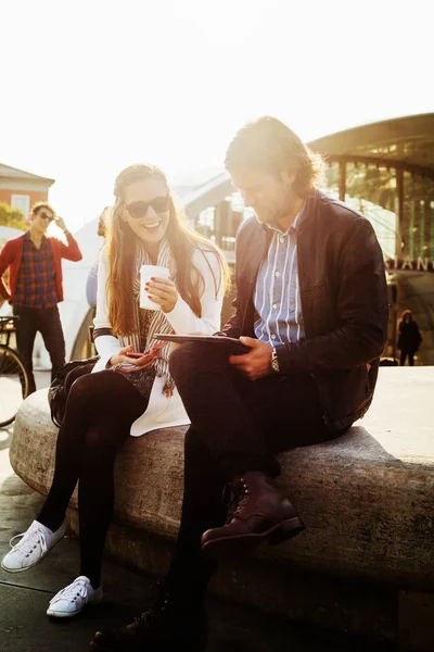 Businesswoman holding coffee with colleague — Stock Photo, Image