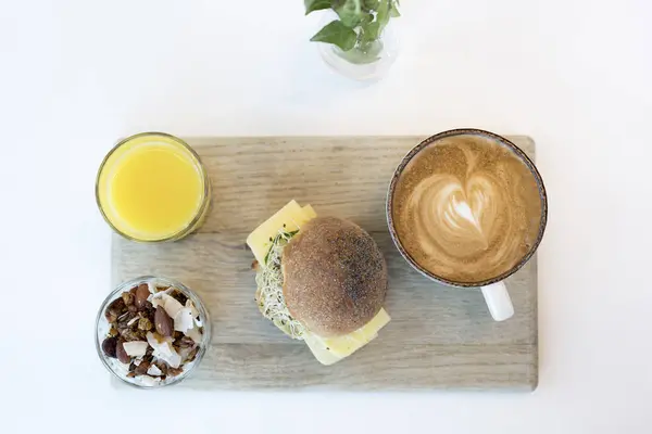 Orange juice, sandwich and cappuccino — Stock Photo, Image