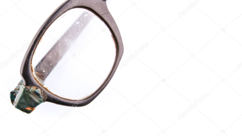 Old broken eyeglasses on white background, banner with place for text. Concept - update your old accessory
