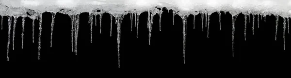 Icicles on a black background, space for text, template for design — Stock Photo, Image