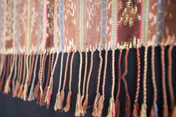 Traditional Indonesian and Asian pattern on fabric with tassels