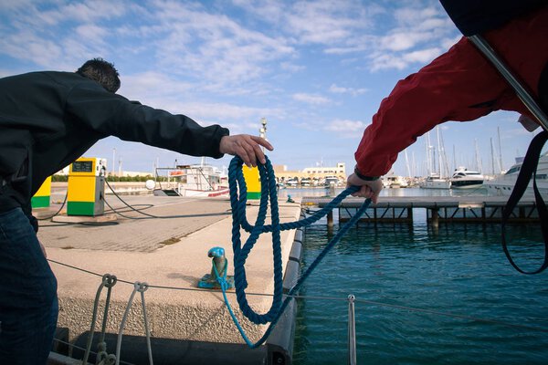 The sailors moored the boat to the dock