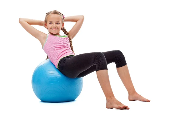 Young girl doing abdominal gymnastic exercises — Stock Photo, Image