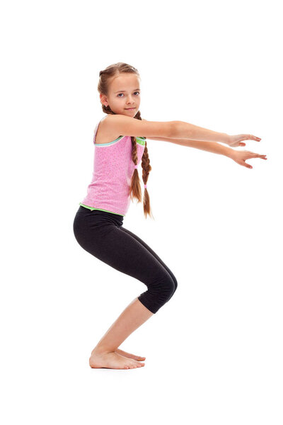 Young girl doing gymnastic exercise