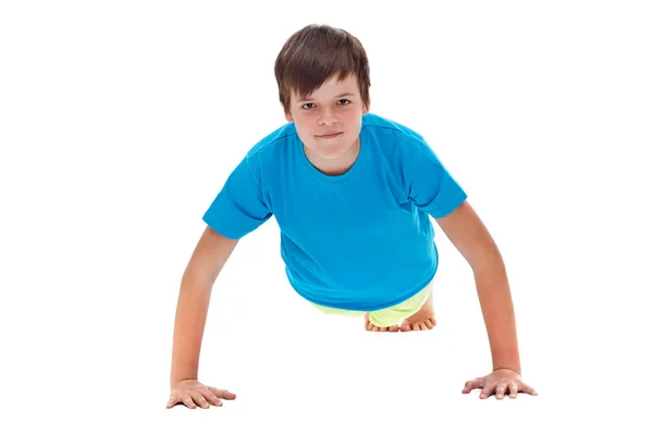 Young boy doing push ups - front view — Stock Photo, Image