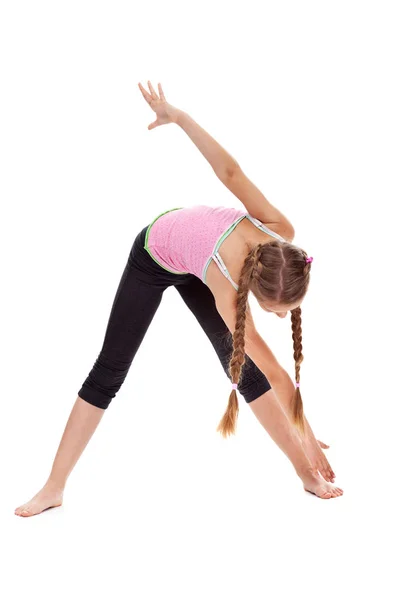 Mladá dívka dělá strečink a pružnost gymnastická cvičení — Stock fotografie