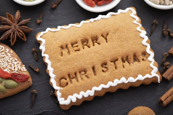 Christmas food concept - gingerbread cookie with merry christmas