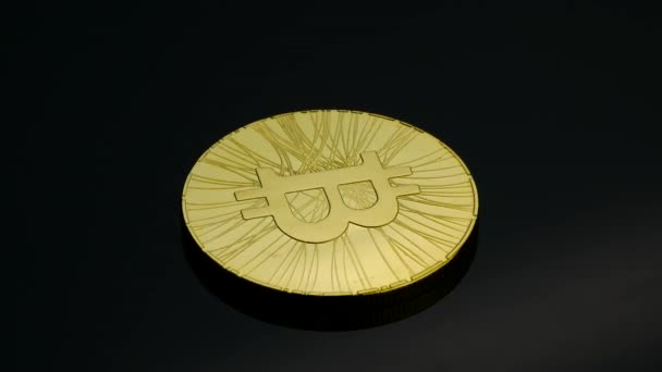 Pièce de monnaie de bit d'or rotative sur le fond noir — Video