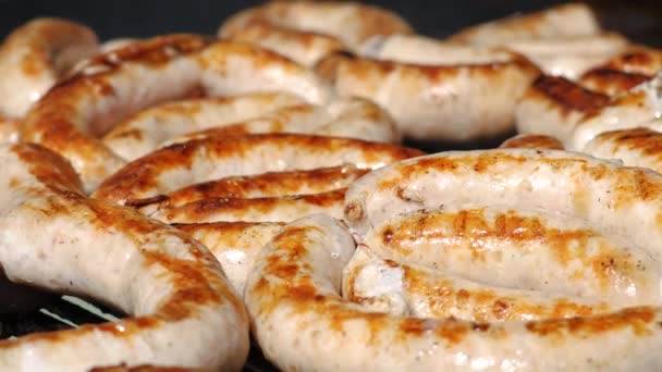 Street food. Close up of grilled sausages — Stock Video