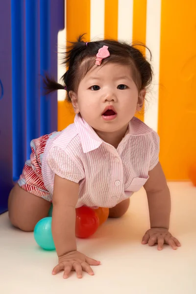 Chinese Baby Girl playing with balls — Stock Photo, Image