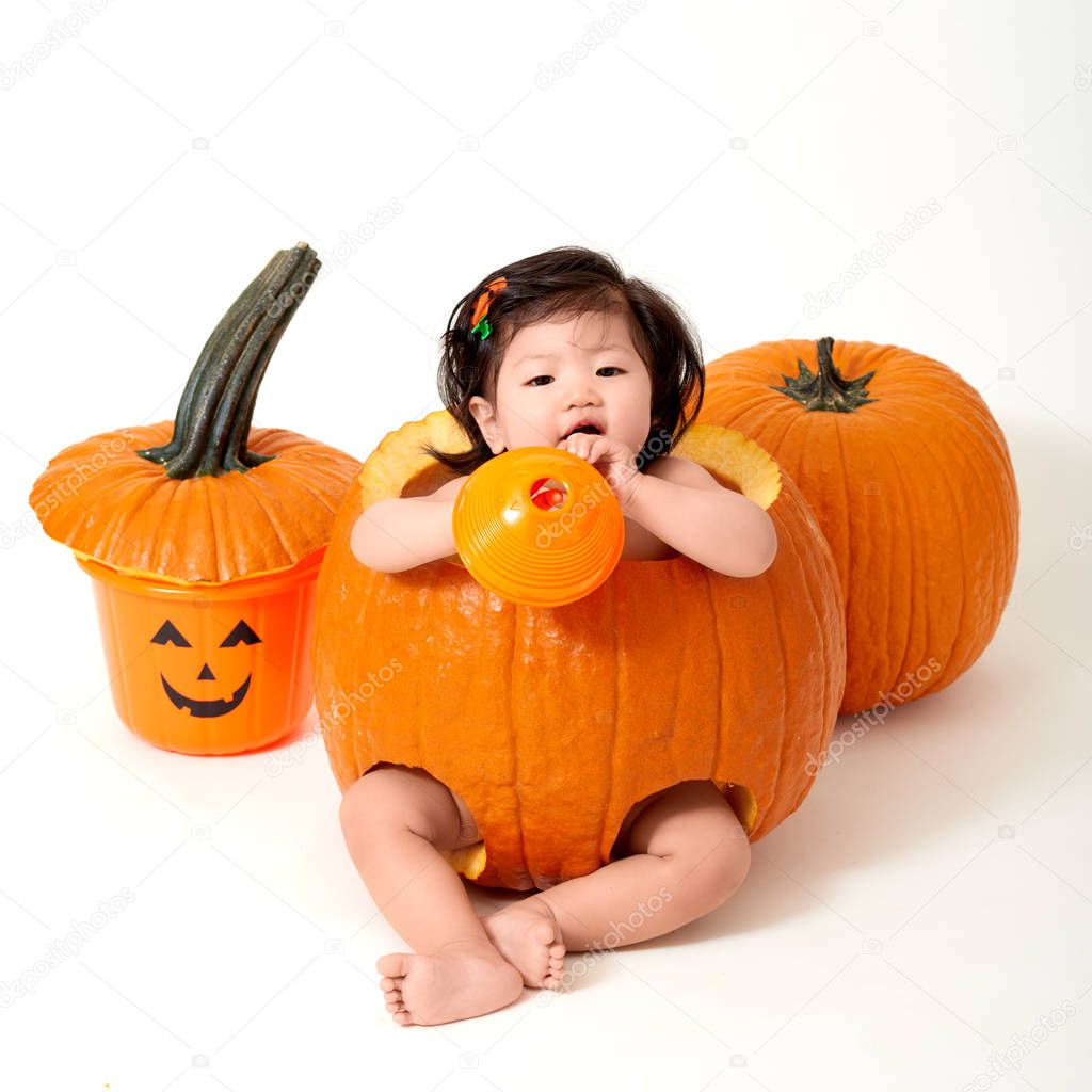 Baby girl inside the pumpkin