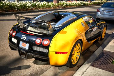 Yellow Bugatti Veyron on Rodeo Drive of Beverly Hills. clipart