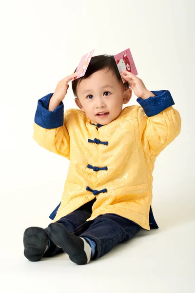 Chinese baby boy in traditional Chinese New Year outfit — Stock Photo, Image