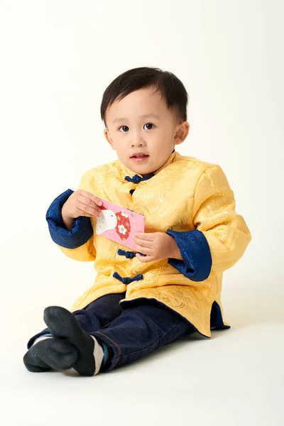 Chinese baby boy in traditional Chinese New Year outfit — Stock Photo, Image