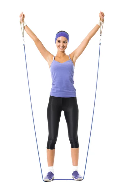 Kvinna i violett sportkläder gör fitness motion med tillväxt — Stockfoto