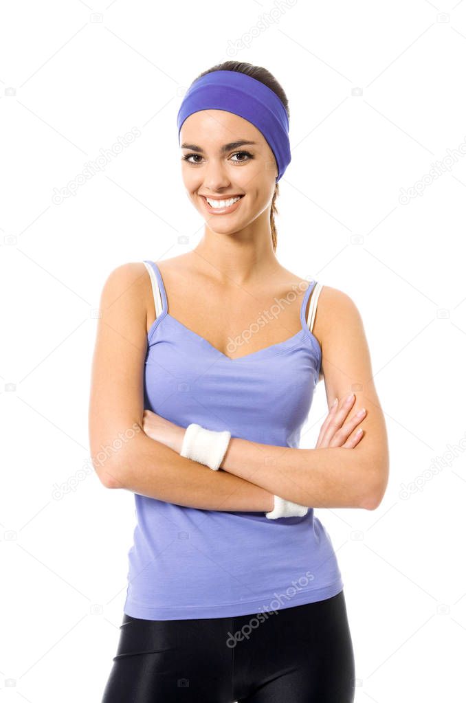 Portrait of smiling sporty brunette woman, on white