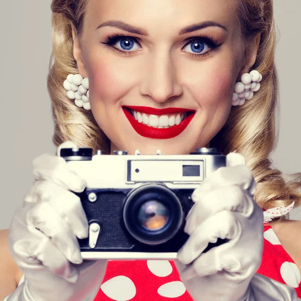 woman, with no-name camera, taking picture, dressed in pin-up st