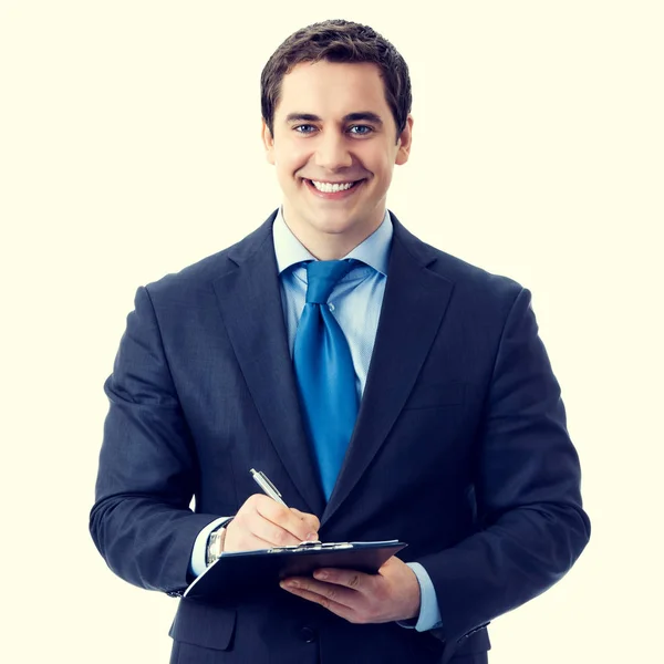 Happy smiling businessman with clipboard writing — Stock Photo, Image