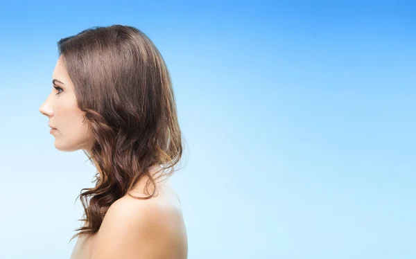 Portrait of beautiful woman, on blue — Stock Photo, Image