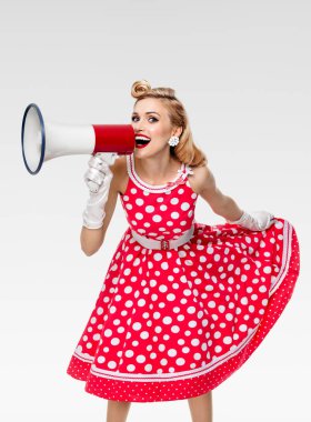 happy woman holding megaphone, dressed in pin-up style red dress clipart
