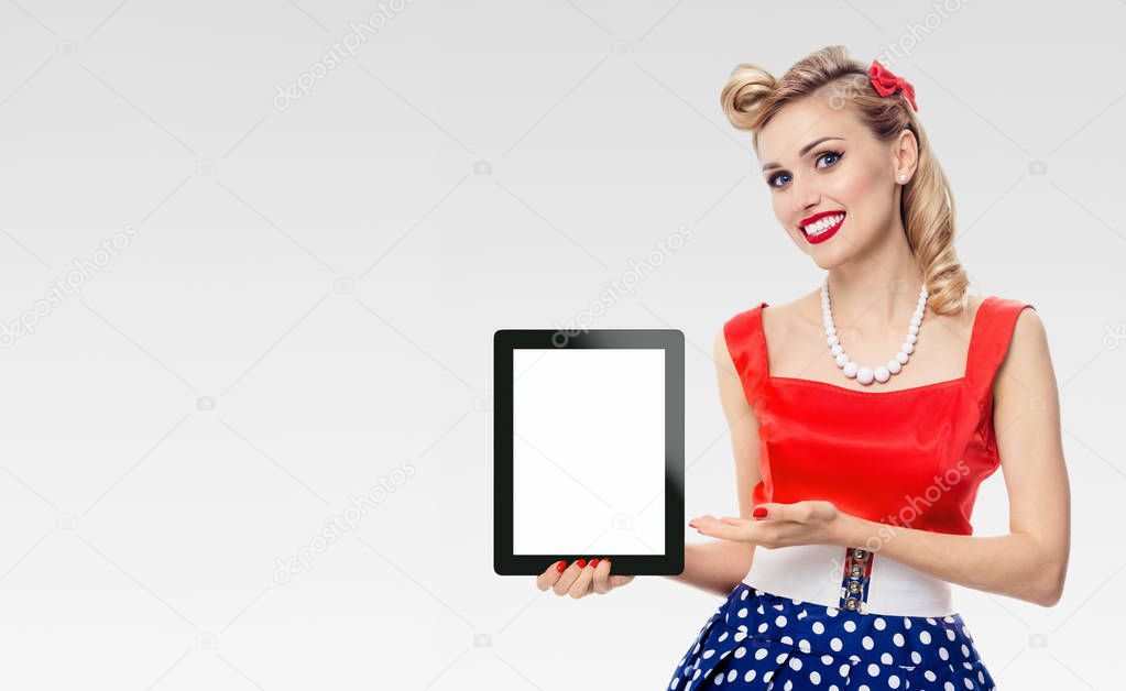 Woman, showing blank no-name tablet pc monitor, with copyspace