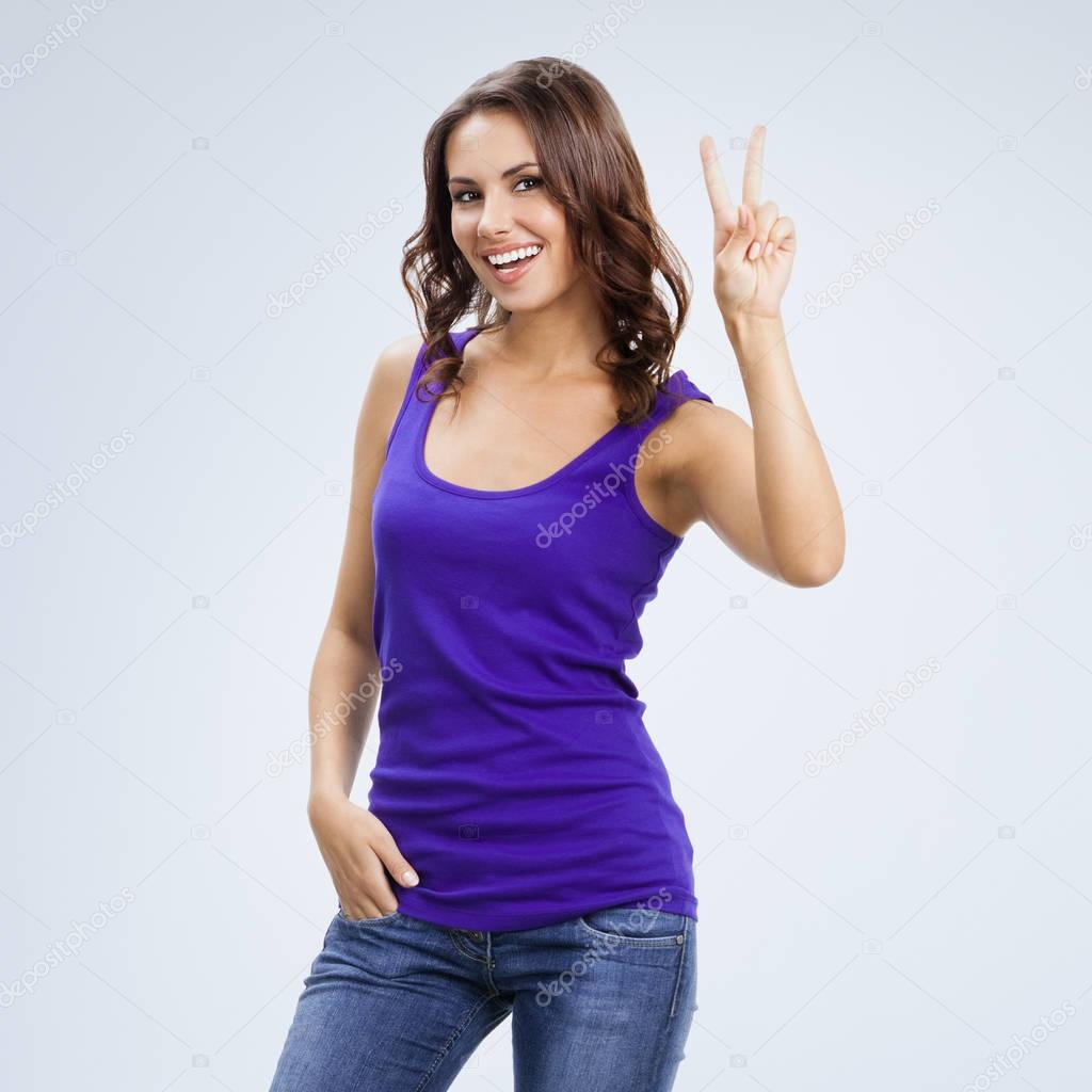 Woman showing two fingers or victory gesture