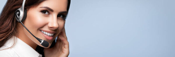 customer support phone operator in headset, against grey