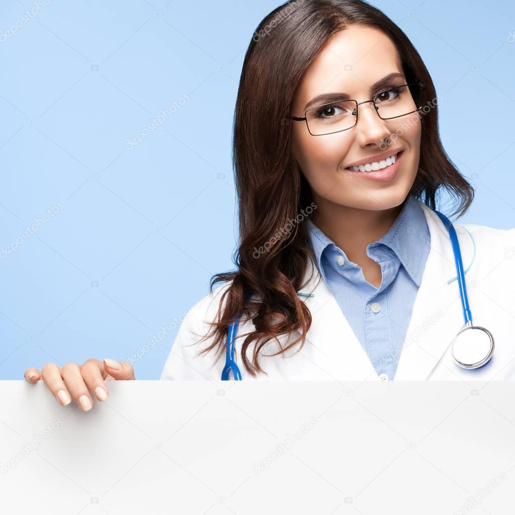 doctor showing blank signboard with copyspace