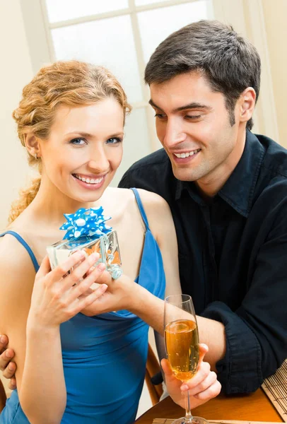 Young couple celebrating with champagne — Stock Photo, Image