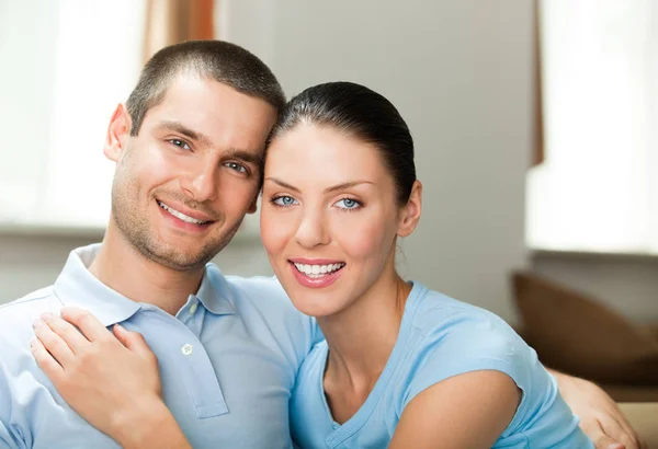 Young happy smiling attractive couple at home Stock Image