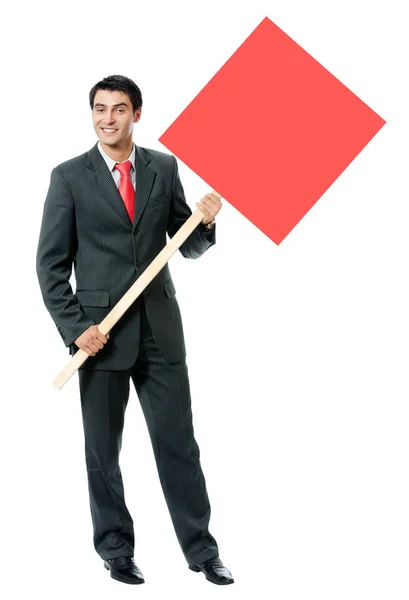 Smiling businessman showing red signboard, isolated — Stock Photo, Image