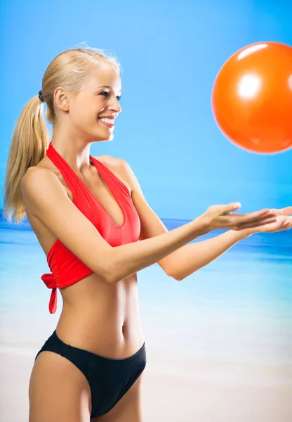 Woman in swimwear playing with gym ball — Stock Photo, Image