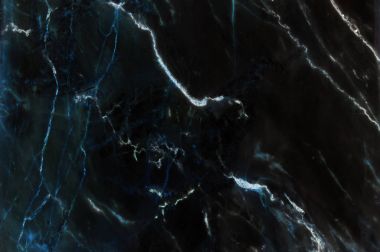 Arka plan için doğal desenli koyu siyah Mermer doku.