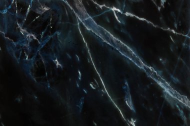 Arka plan için doğal desenli koyu siyah Mermer doku.