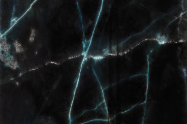 Arka plan için doğal desenli koyu siyah Mermer doku.