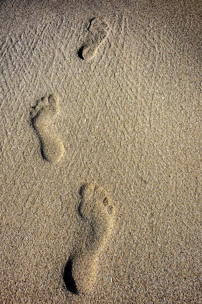 Human footprints in the sand