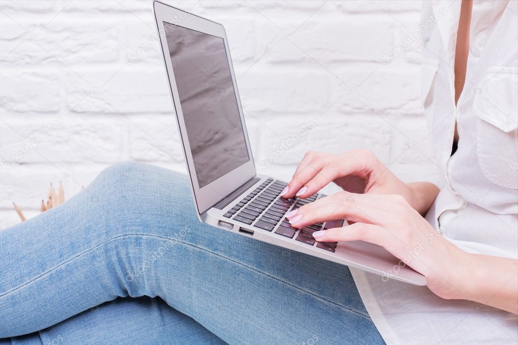 Girl using laptop side
