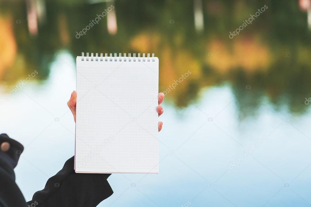 Woman holding notepad