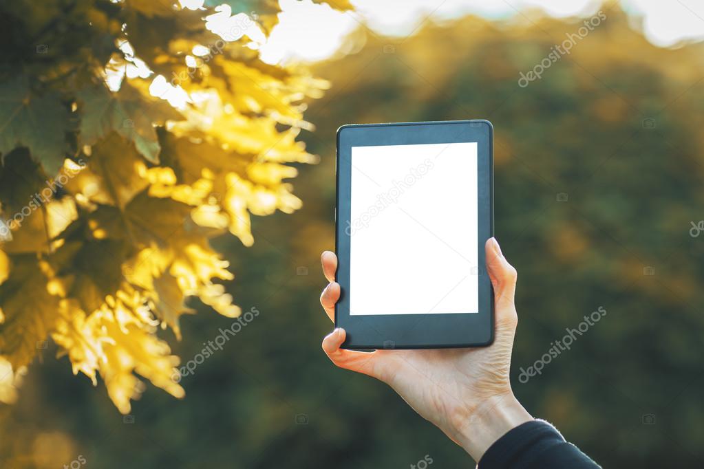 Girl holding white tablet