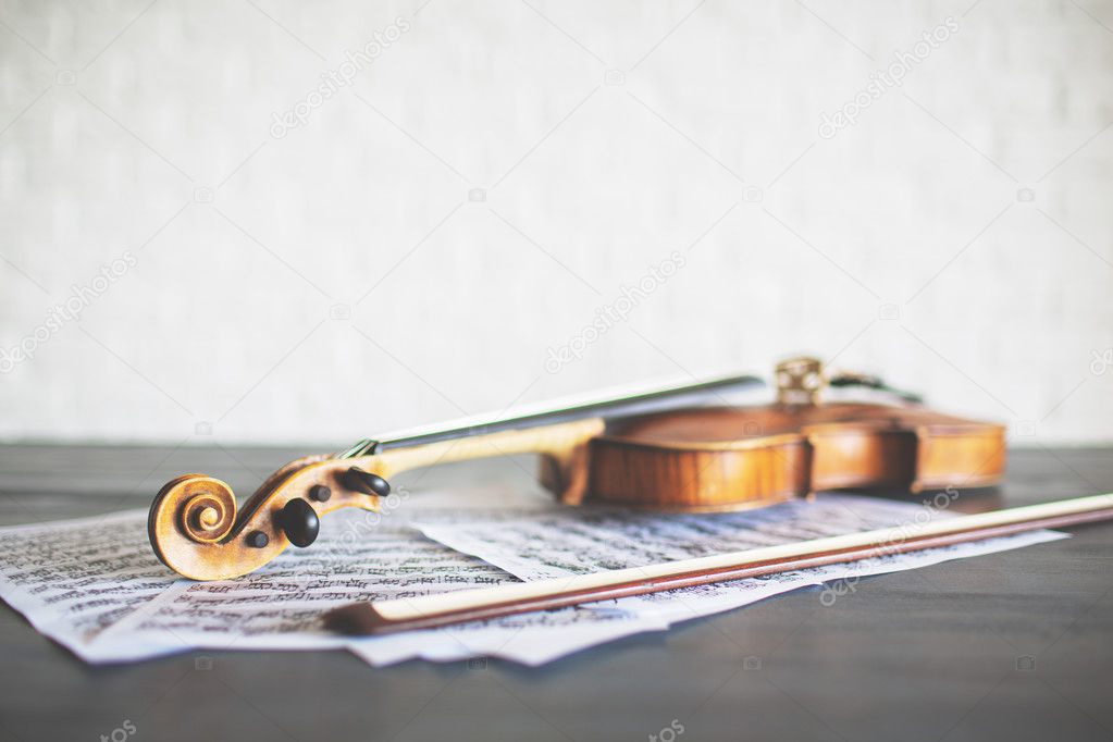 Violin, bow and music sheets