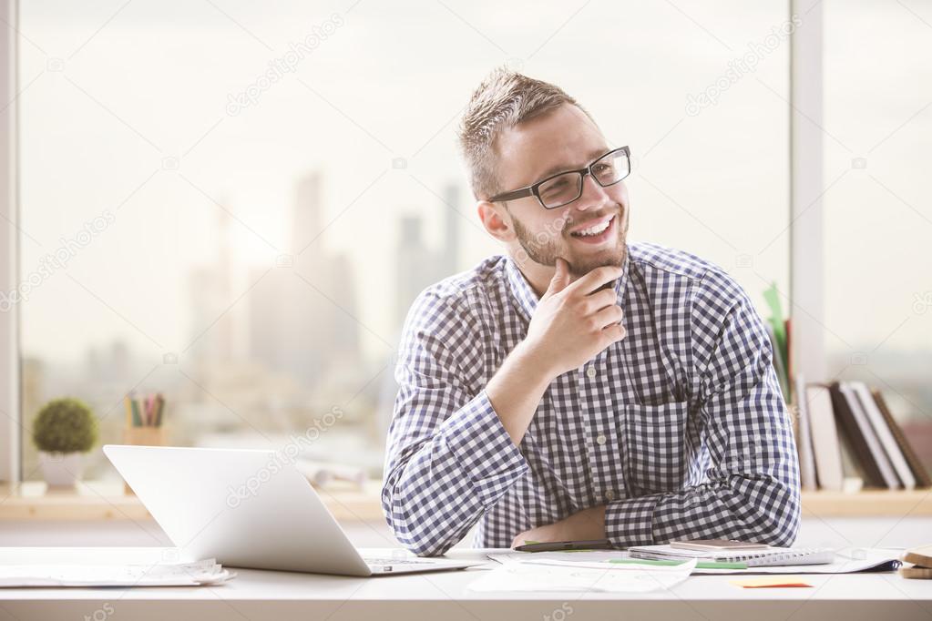 Smiling man at workplace