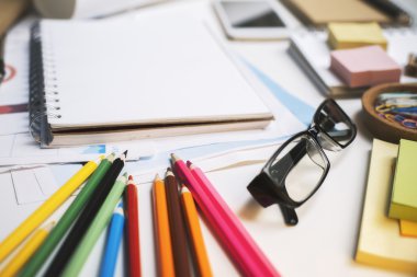 Workplace with glasses and supplies