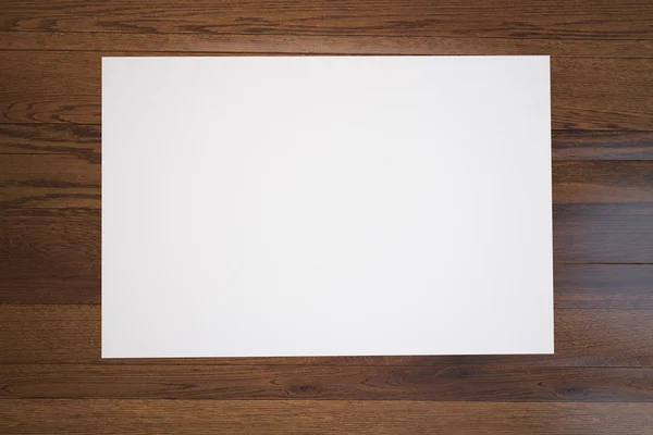 Cartaz em branco sobre madeira — Fotografia de Stock