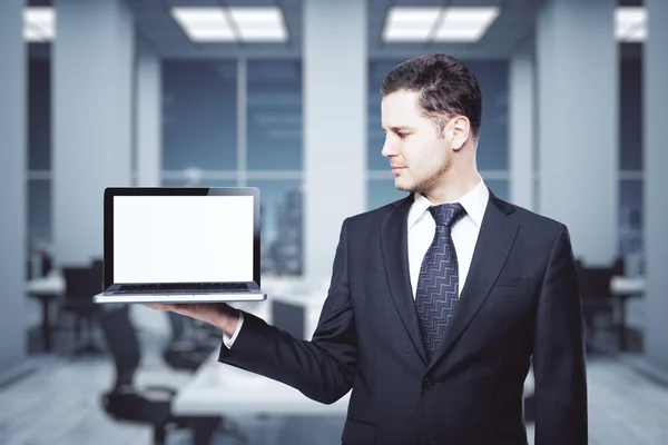 Man holding blank laptop — Stock Photo, Image